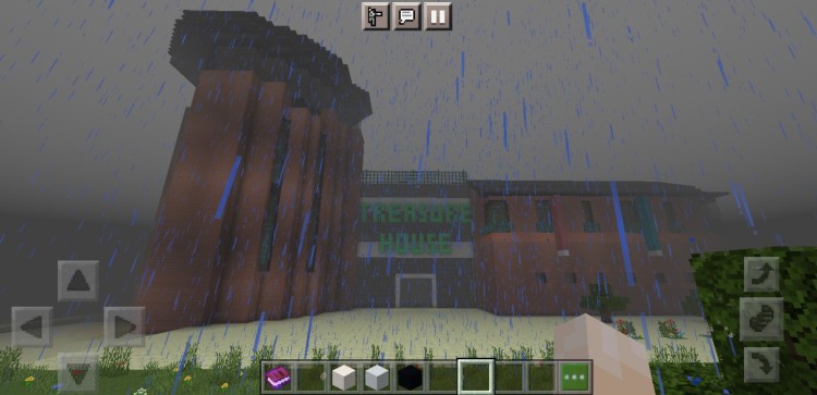 Minecraft Pocket Edition screenshot showing the Treasure House building in the rain